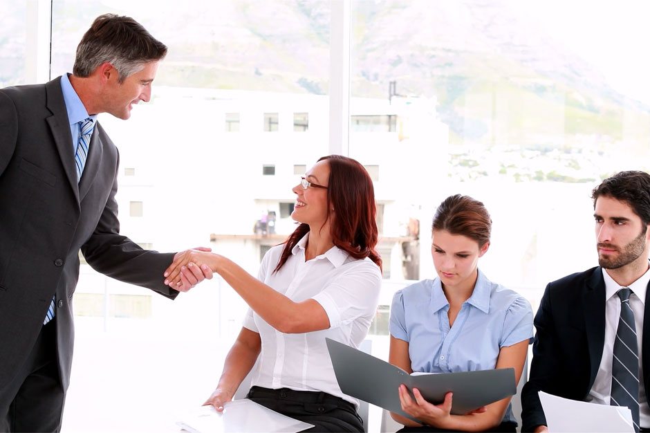 Employer shaking hands with potential employee