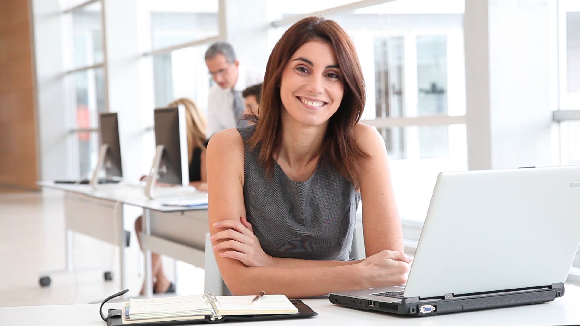 Confident lady working on office computer